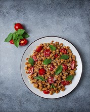 Tuscan pasta with smoked paprika and basil, parmesan cheese, Italian traditional cuisine