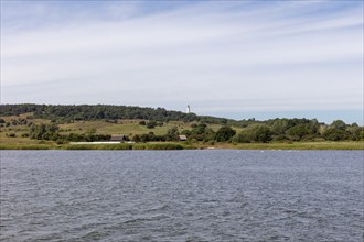 Extensive landscape with hills and calm water under a blue sky, Rügen, Hiddensee