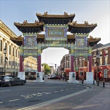 Traditional Chinese Tor tor in urban environment with vehicles, Liverpool