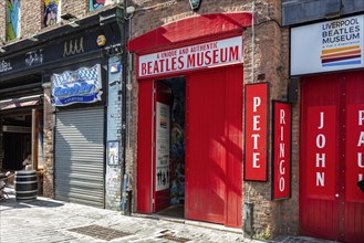 Entrance to the Beatles Museum with striking red sign, Liverpool