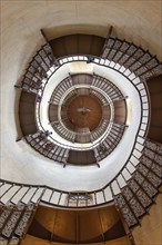 Spiral view of a staircase with ornate banisters and an impressive architectural structure, Rügen,