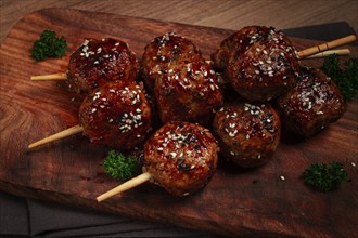 Tsukune, Japanese meatballs, minced chicken, fried on a skewer, with yakitori sauce, homemade, no