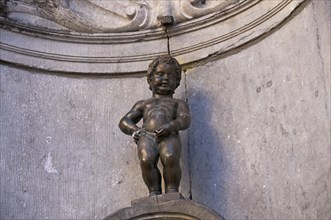 Manneken Pis, also Petit Julien, fountain figure of a urinating boy, sculptor Hieronimus Duquesnoy,