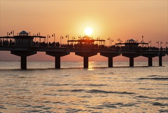 Sunset at the pier in Miedzyzdroje, Western Pomerania, Poland, East Europe, Europe