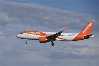 Lisbon, Portugal - September 2, 2023: easyJet Airbus A320-214 passenger plane ascends to landing in