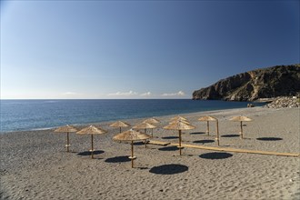 Sunshades on the deserted beach of Sougia in the south of Crete, Greece, Europe