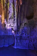 Stalactites illuminated by coloured light, stalactite cave, Höllgrotten, Baar, Canton Zug,