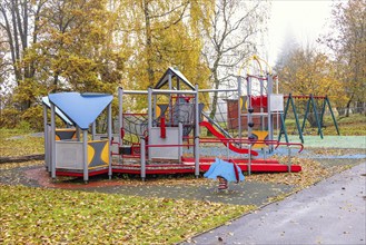 Empty playground with a climbing frame a autumn day in a park