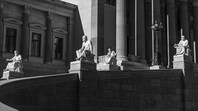 Stone figures on the driveway to the parliament building, black and white photograph, Vienna,