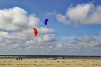 Kite buggy on the beach under a cloudy sky, people enjoying the sandy beach, Sonderhö, Fanö, North