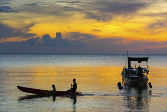 Canoe in the sunset, boat, sun, evening mood, cloudy sky, colourful, orange, wooden boat, sea,