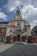 Beer barrels from four breweries in front of the town hall during the Kulmbach Beer Week, Kulmbach,