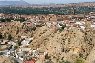 Traditional town embedded in a mountainous summer landscape under a blue sky, Alcazaba, Cathedral,