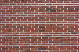 An evenly laid brick wall made of red bricks. The joints are clean and regular, Bergen, Vestland,