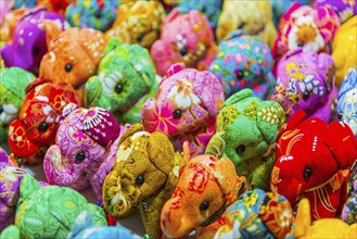 Small colourful elephants as stuffed animals, souvenir, souvenir, stuffed animal, child, childhood,