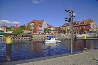 Europe, Germany, Mecklenburg-Western Pomerania, island town of Malchow, Lake Malchow, at the swing