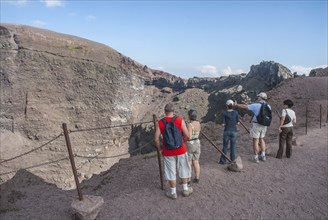 Tourists on a path along the crater edge, Vesuvius, near Naples, Parco Nazionale del Vesuvio,