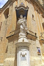 Madonna and baby Jesus Christ statue, Carmelite church and priory in medieval city of Mdina, Malta,