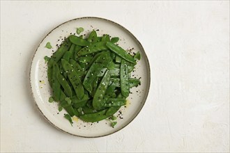 Salad of young peas, in pods, with sesame seeds, asian cuisine, homemade