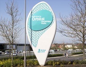 Sign for Orbital Shopping Park developed by British Land, north Swindon, Wiltshire, England, UK