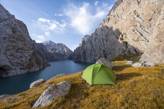 Wild camping, camping in the wilderness with a tent in front of mountain lake Kol Suu, Sary Beles