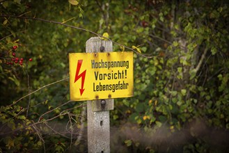 Autumn in the Gebergrund near Rippien. Caution high voltage sign. Rippien, Saxony, Germany, Europe