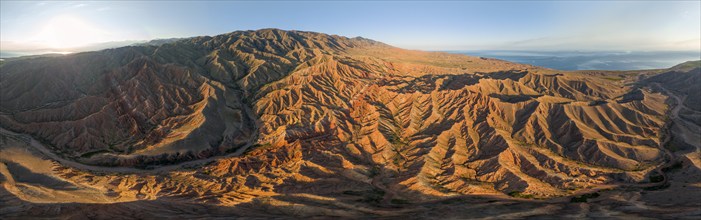 Aerial view, eroded mountain landscape, sandstone cliffs, canyon with red and orange rock