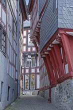 Half-timbered houses in narrow alley, idyll, red wooden beams, narrow, old town, Limburg, Hesse,