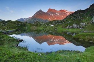 Chli Sustenhorn and Sustenhorn reflected in the Seebodensee, Canton Bern, Switzerland, Europe