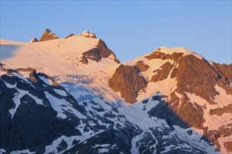 First light hits summit of Hinter Tierberg, Mittler Tierberg and Vorder Tierberg, with