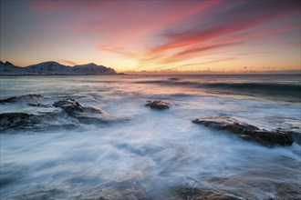 Sunset in winter at Skagsanden, rock formations on the beach at Flakstad, Flakstadøy, Lofoten,