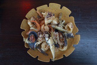 Deep-fried seafood, fritto misto baked on a plate of bread dough, Burano, Venice, Italy, Europe