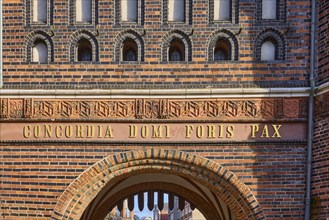 City gate Lübeck Holstentor, inscription Concordia domi foris pax with the meaning harmony inside