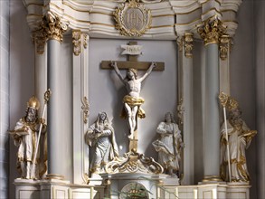 The side altar of the Catholic parish church of St. Johannes Baptist, showing statuesof the saints