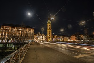 Christmas illuminated Mur bridge, behind Frnziskanerkirche, light trails, night shot, Graz, Styria,