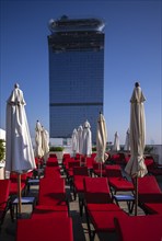 Deckchairs, sunshades, view from Rooftop Terrace Hotel NH Collection The Palm to Hotel St. Regis,