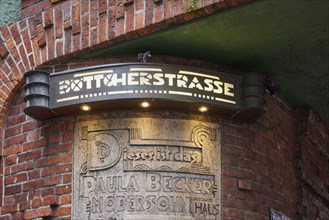 Artistic illuminated street sign Böttcherstrasse in Bremen, Hanseatic City, State of Bremen,