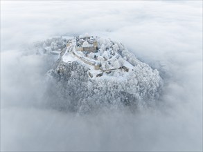 Aerial view of the Hegau volcano Hohentwiel with Germany's largest fortress ruins rising out of the