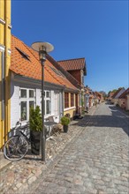 Old town of Rudkøbing, renovated houses, colourful row of houses, dormers, lantern, decorative