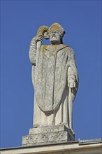 Martin of Tours with crosier on the roof of the church Saint Martin, saint, sculpture, arm, jug,