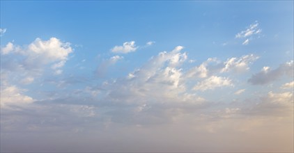 Peaceful and serene sky with clouds on sunset background