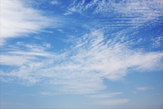 Peaceful and serene blue sky with white clouds background