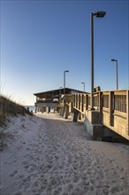 Gulf State Park fishing pier at dawn on the beach of Gulf Shores, Alabama