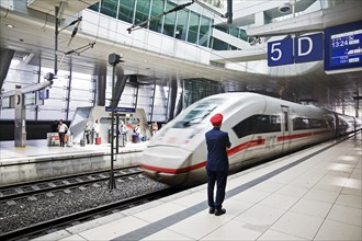 ICE at the centre platform with Deutsche Bahn staff, long-distance train station, airport,