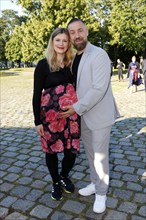 Citizen Lars Dietrich and his pregnant partner Hannah Baus arriving for the anniversary premiere of