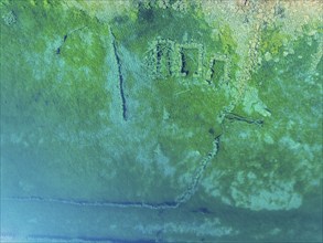 Arial view of ruins in lake Lygnstoylvatnet, lake dammed up by a rock slide, valley Norangsdalen,