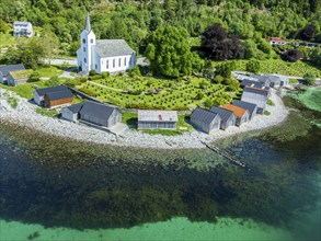 Aerial view of beach and church in Selje, wooden boat sheds, Stad, Vestland, Norway, Europe