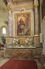 Interior view of the town church of St Symphorian, altar with wall painting, columns, arts and