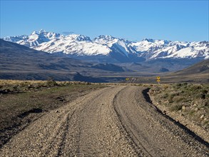 Gravel road X-753 from Chile Chico to Jeinimeni NP, snowcovered mountain range at the border to