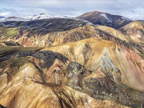 Early snow on the colorful rhyolite mountains, mt. Brennisteinsalda, lava fields, Landmannalaugar,